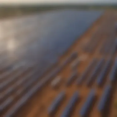 Expansive Solar Panel Array in Operation Aerial view of a large scale solar farm highlighting solar panels under the sun.